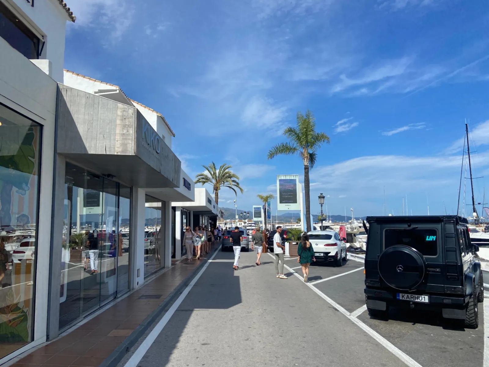 Designer boutiques including Kiko lining the Puerto Banús marina promenade