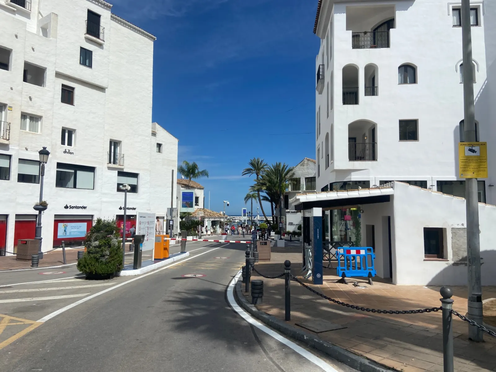 Pedestrian entrance plaza to Puerto Banús with traditional Andalusian architecture